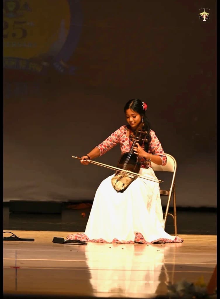 Yeju Shrestha performing the Sarangi at a cultural event